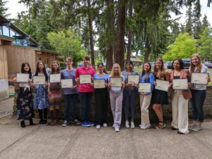 Our 2022 student scholarship recipients holding their awards