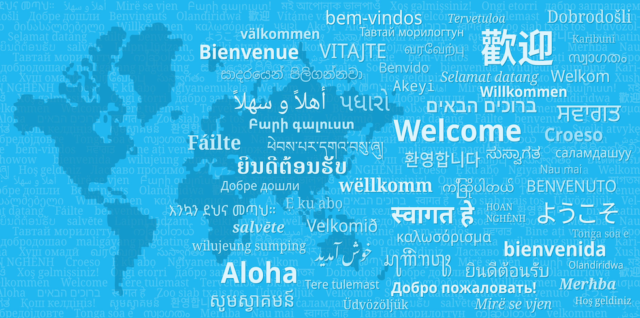 The word "welcome" is printed in many languages against a blue background depicting a pixelated map of the world